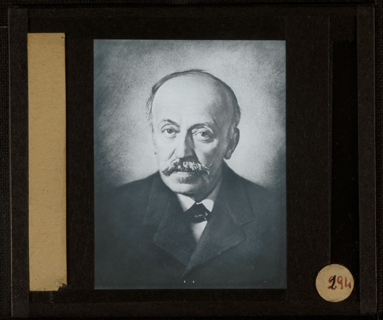 Star trails over a cloud-filled valley at night