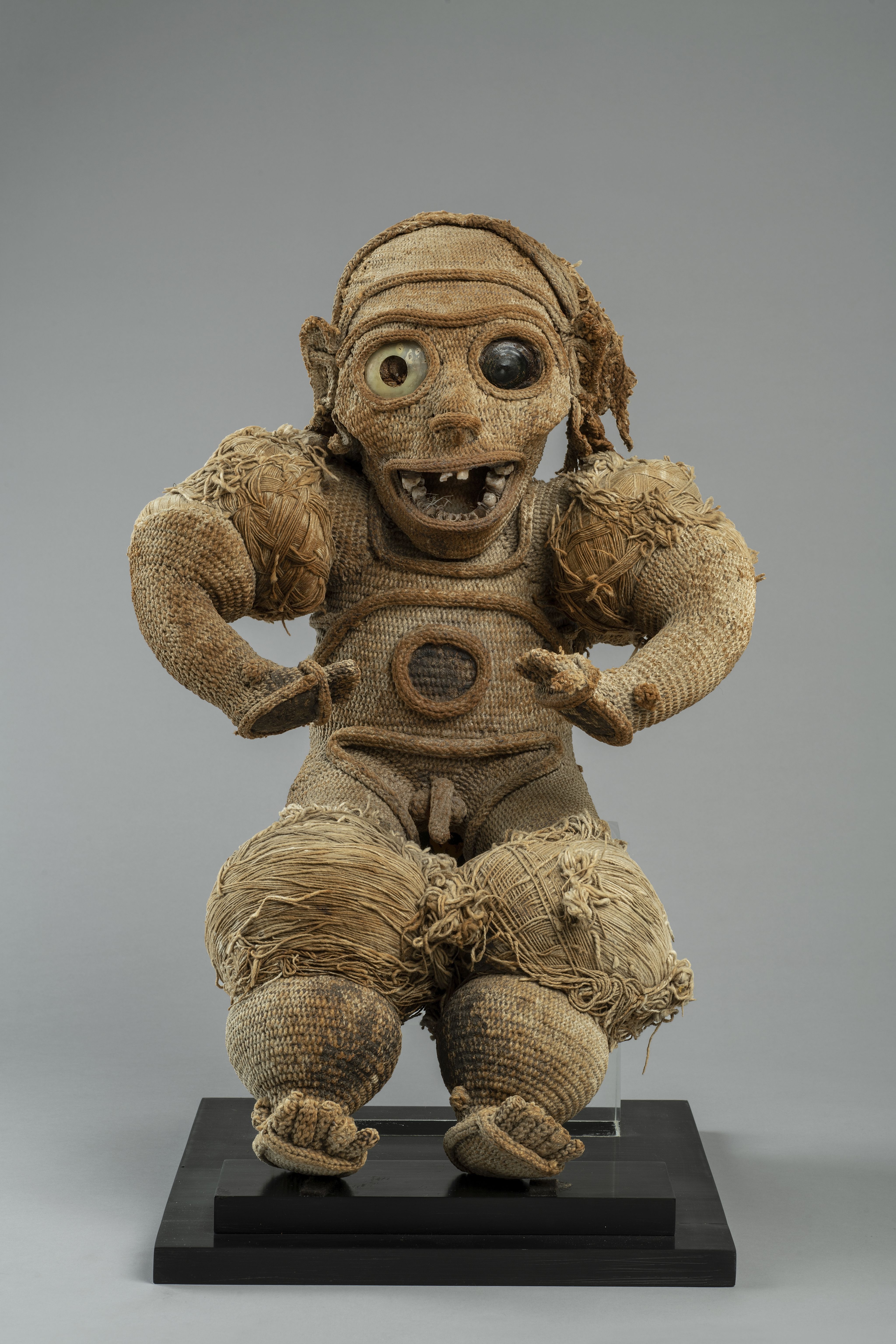 A vase with a flower in it sitting on a table